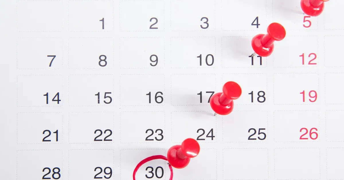 A calendar with payment due dates pinned and the 30th circled in red