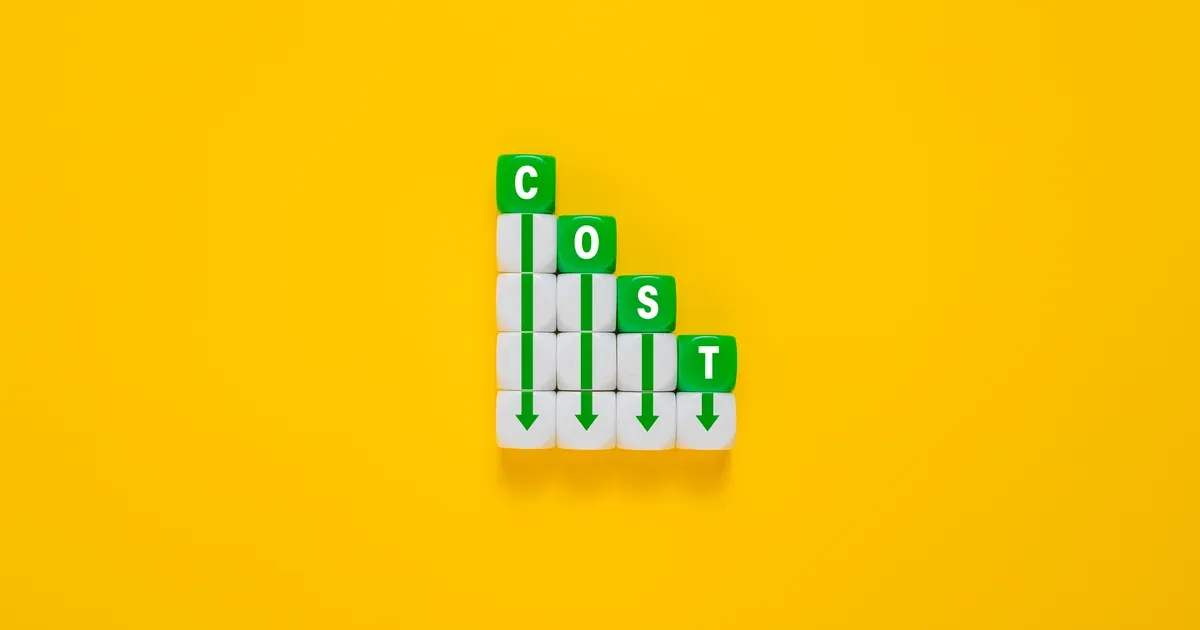 Cubes spelling COST arranged as descending steps with green down arrows, on a yellow background