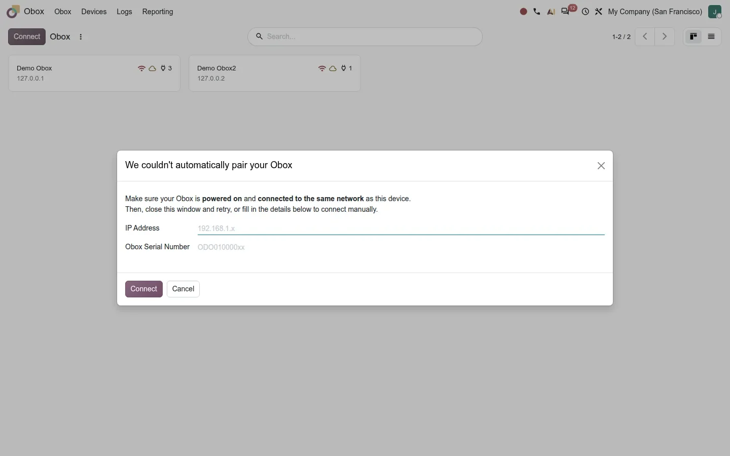 Dialog titled We couldn't automatically pair your Obox with IP address and serial number inputs