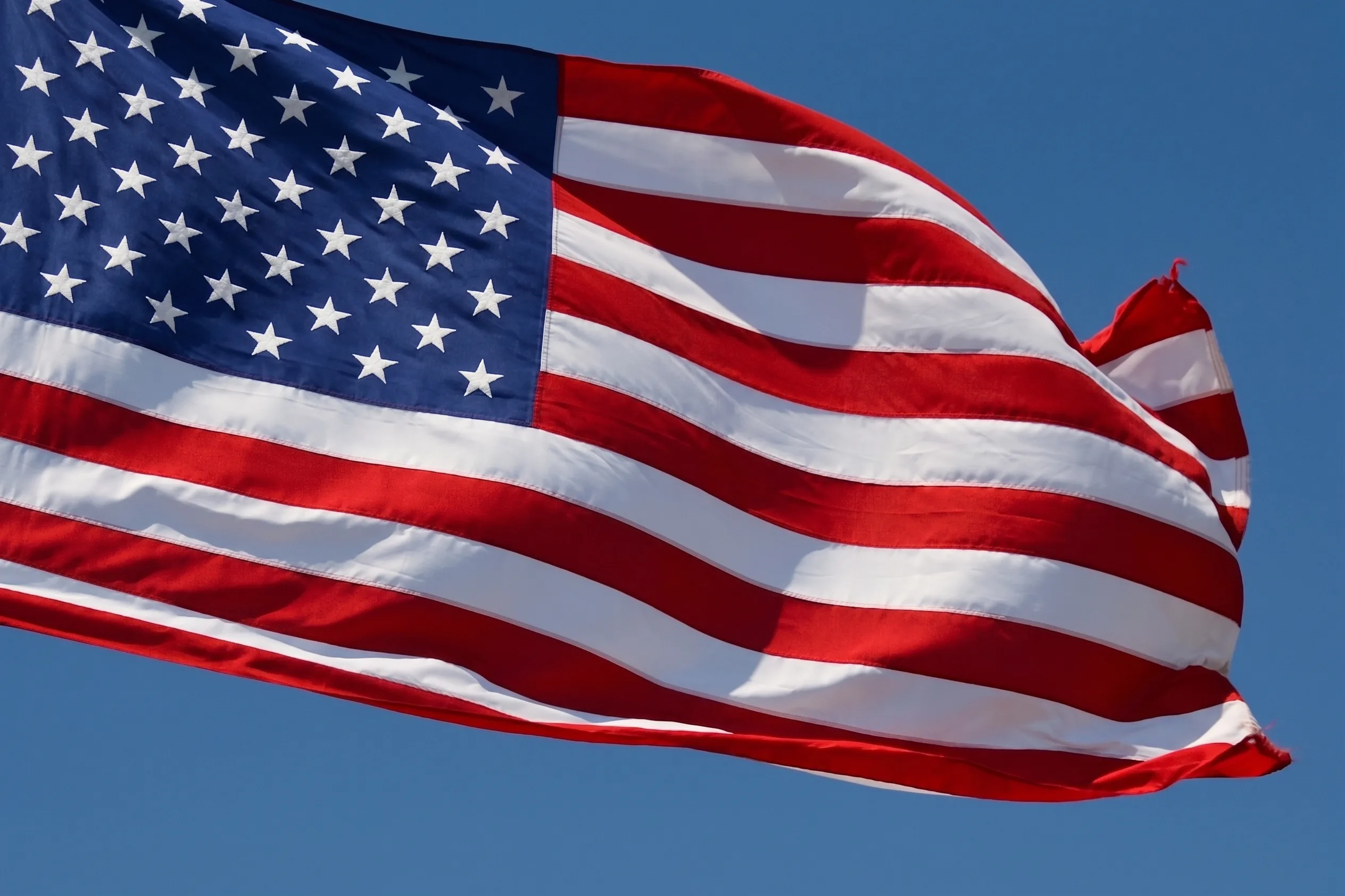 Stars and Stripes flag background representing the United States